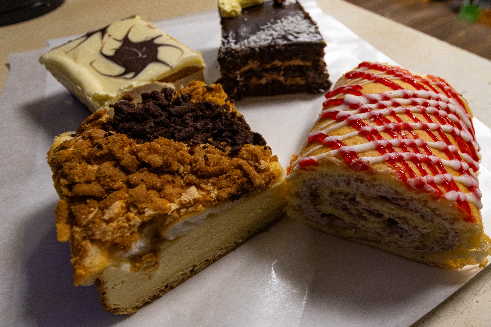Slices of traditional Polish cakes including sernik and makowiec