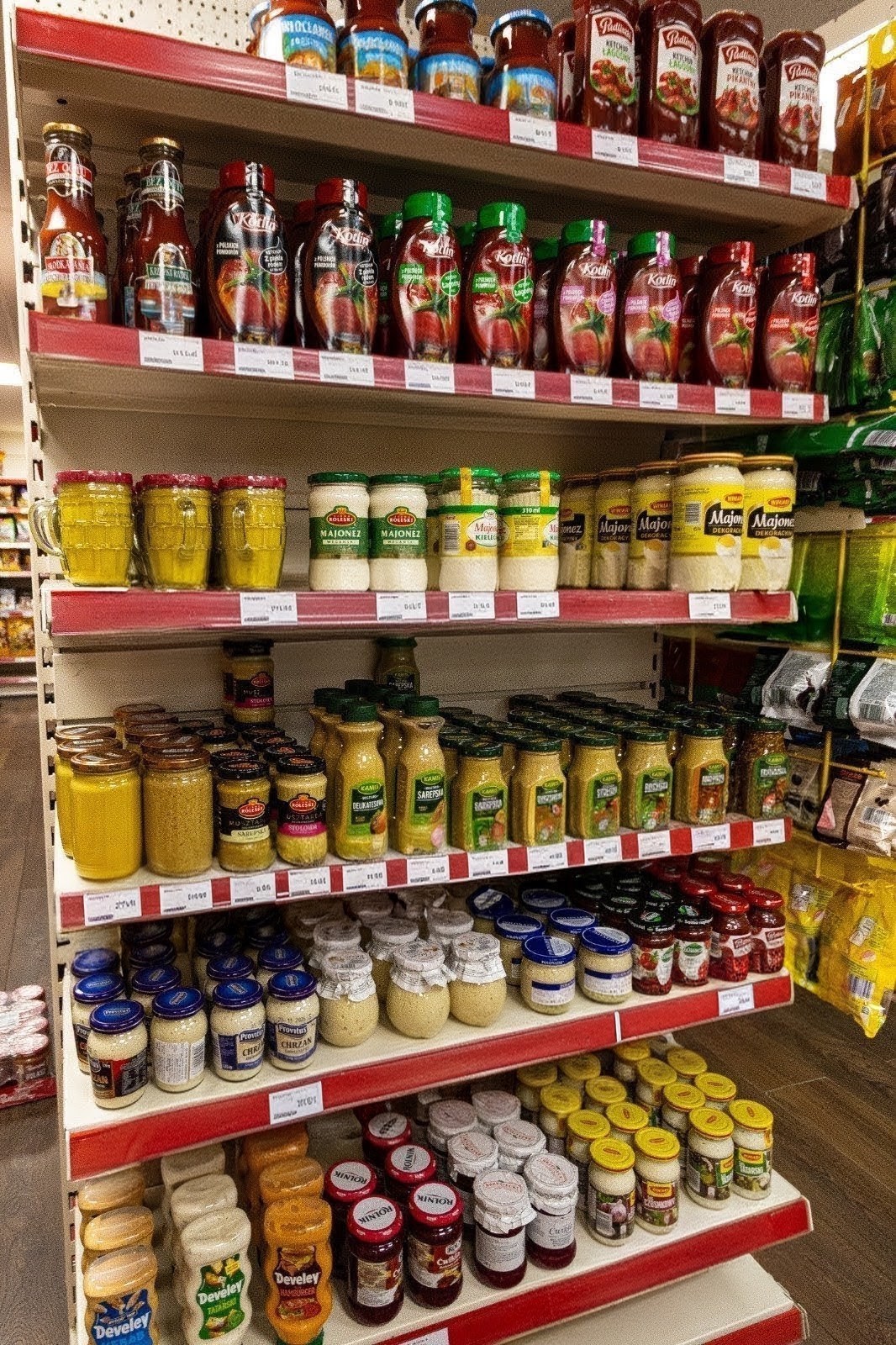 Polish ketchups, mayonnaise, mustards and horseradish on the shelves