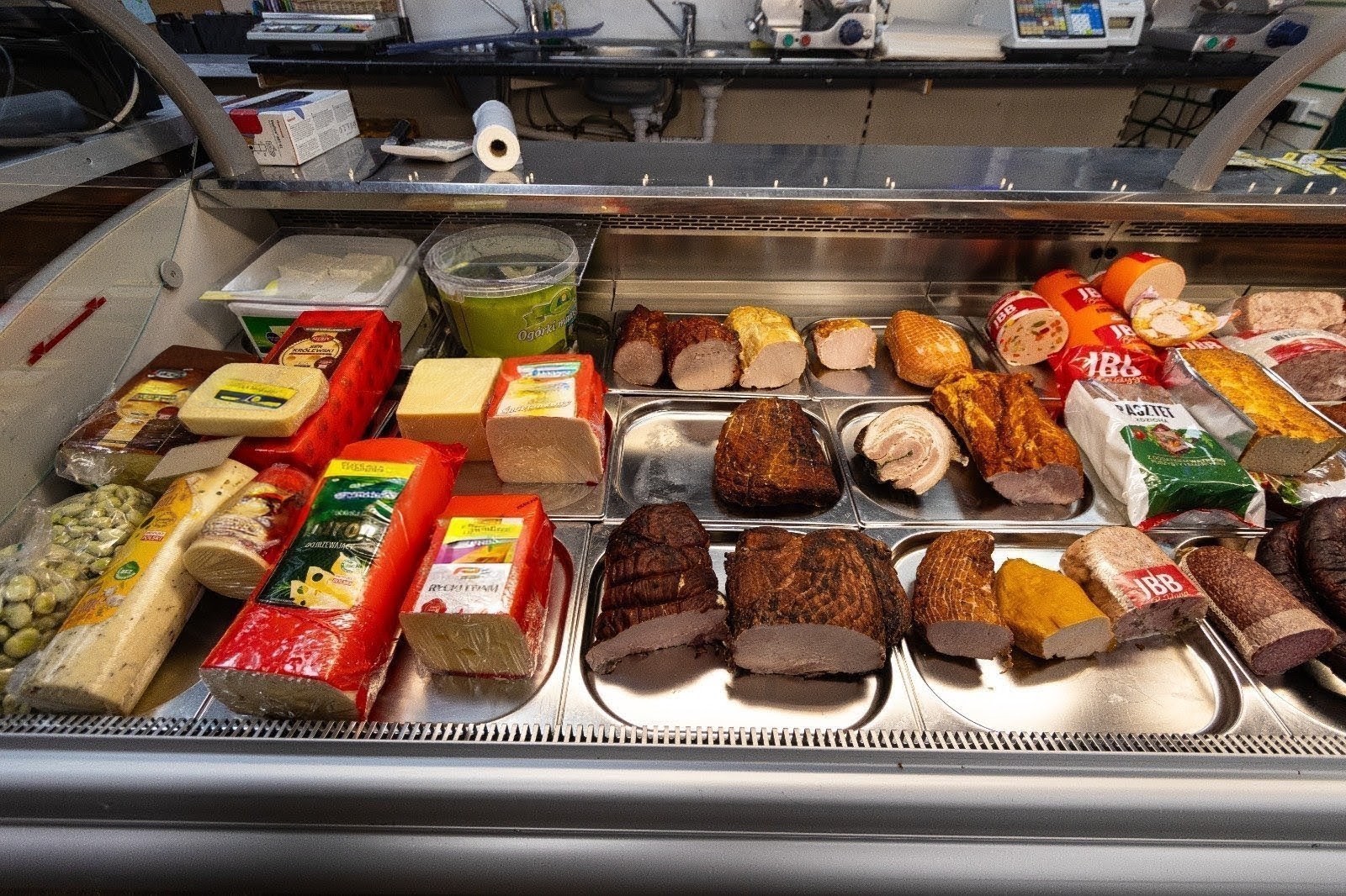 Polish deli counter with cheeses, hams and cold cuts 1