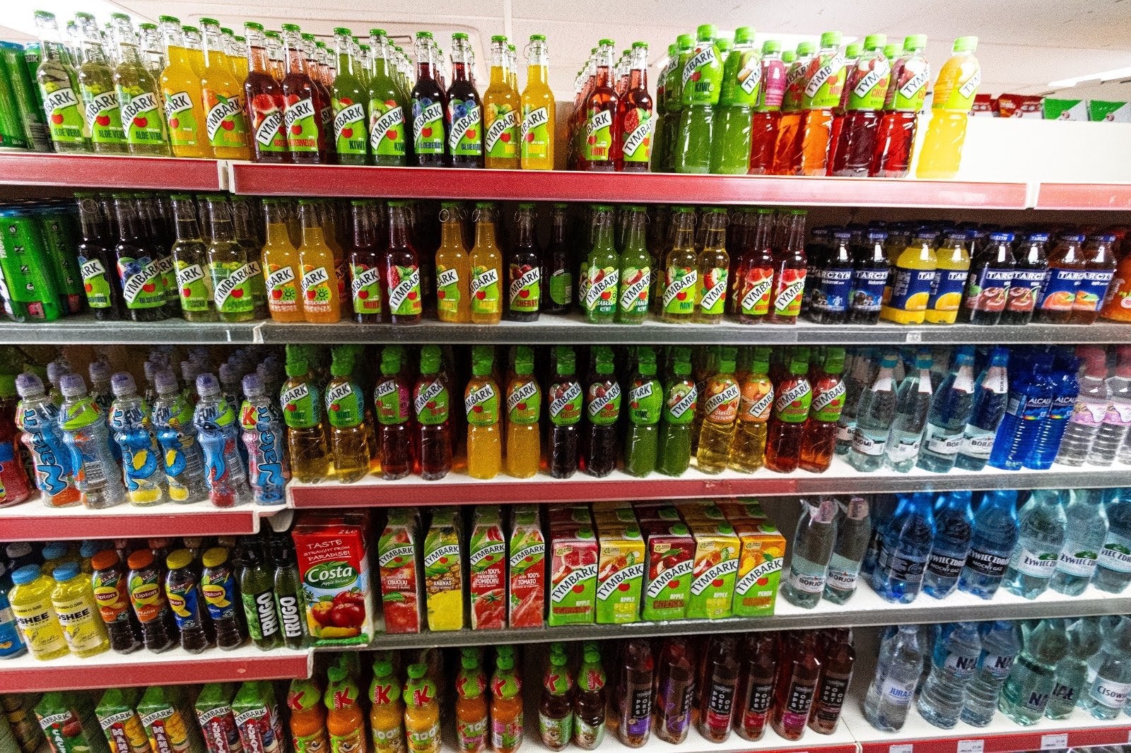 Polish soft drinks, Tymbark juices and fruit pouches on the shelves 1