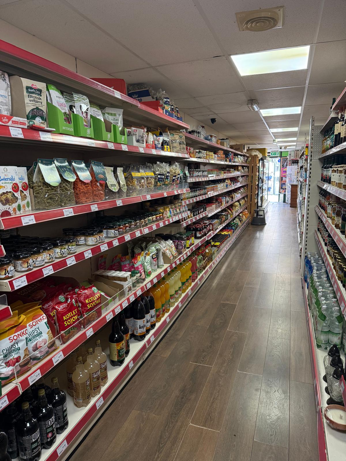 Inside Taste of Europe — a wide view down the shop aisle