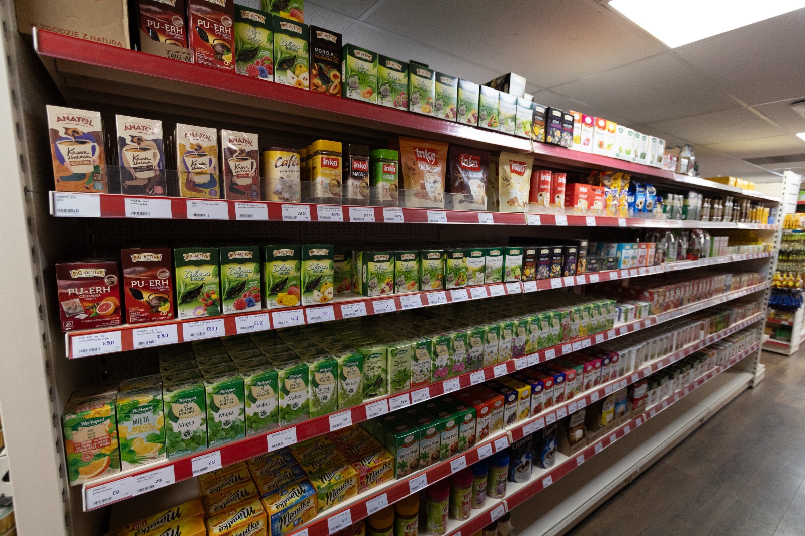 Polish teas and jars of coffee on the shelves