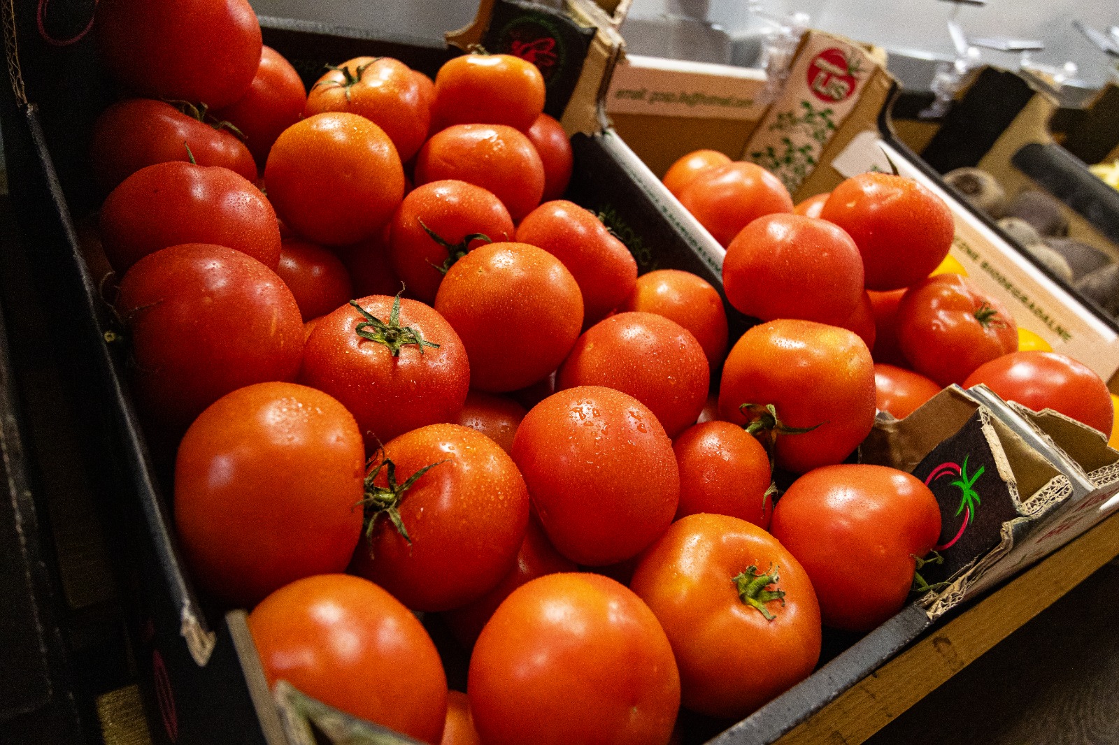 Fresh fruit and vegetables on display down the shop aisle 2